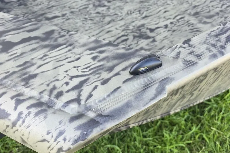 Slide: The Image of 2026 Tracker Grizzly 1650 T Prairie Wings Edition boat with camouflage pattern detail. - 9