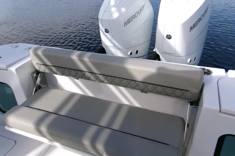 Slide: The Image of 2025 Sportsman Open 322 Center Console with dual Mercury Verado engines and cushioned seating. - 31