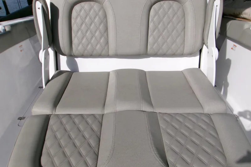 Slide: The Image of 2025 Sportsman Open 322 Center Console boat seat with diamond-stitched upholstery. - 5