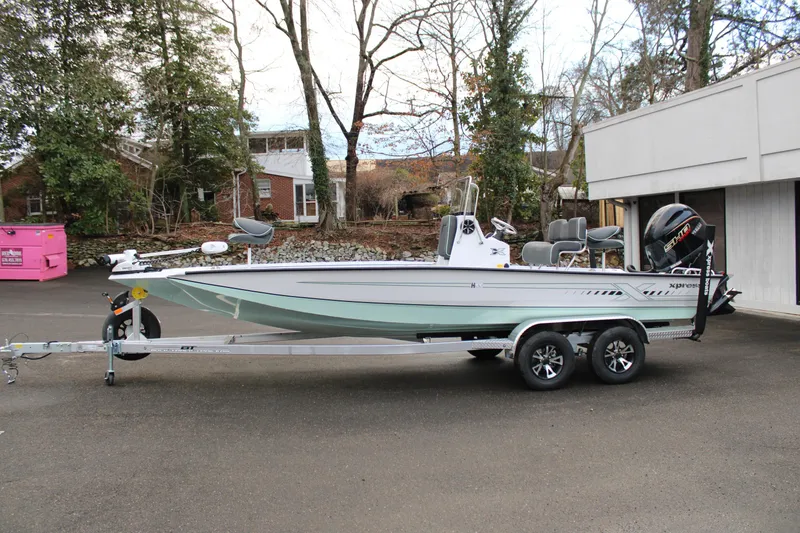 The Image of 2026 Xpress H22B Bay boat on trailer, parked outdoors. - 0