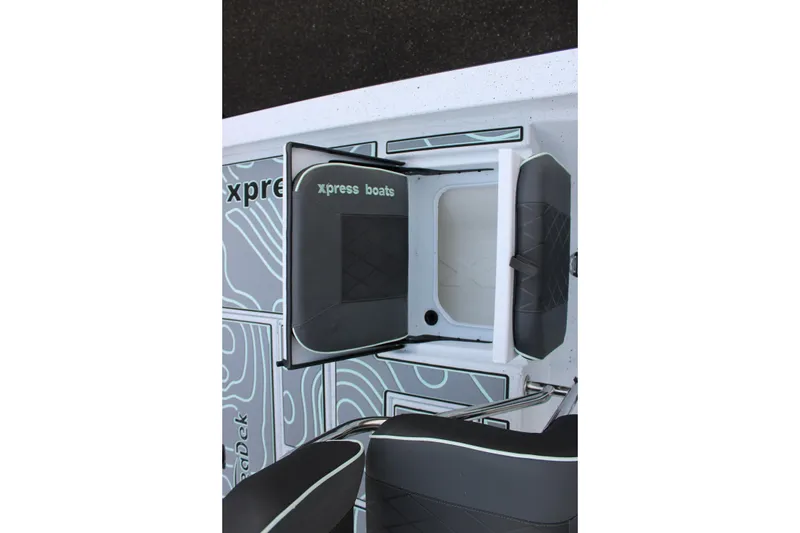 Slide: The Image of 2026 Xpress H22B Bay boat interior with storage compartment and seating. - 11
