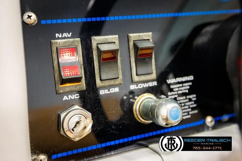 Slide: The Image of Control panel of a 1988 Celebrity 180 V boat with switches and ignition key. - 27