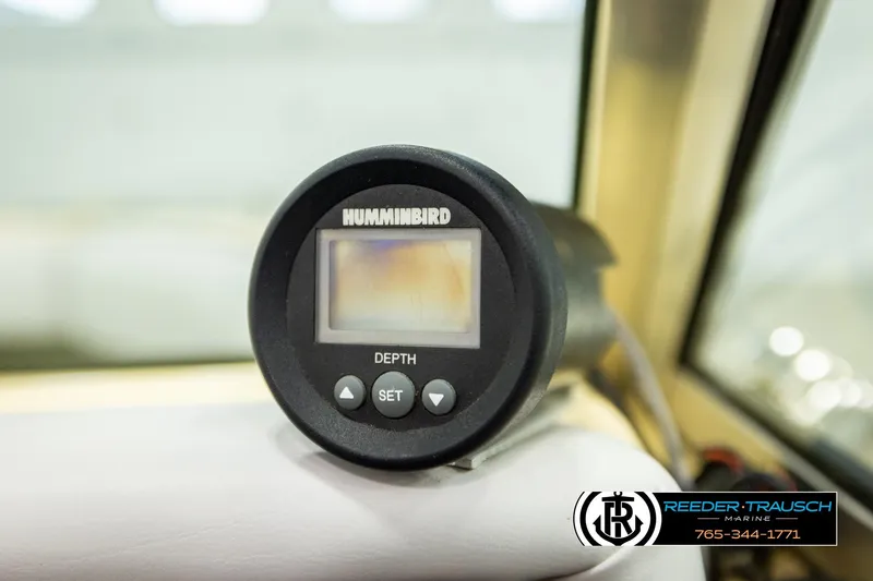 Slide: The Image of Humminbird depth gauge on 1988 Celebrity 180 V boat dashboard. - 30