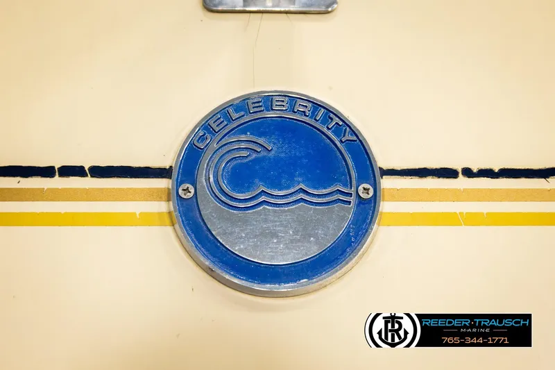 Slide: The Image of 1988 Celebrity 180 V boat emblem with blue wave design and Reeder-Trausch Marine logo. - 41
