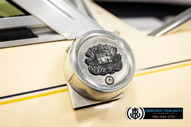 Slide: The Image of Close-up of a 1988 Celebrity 180 V boat detail with decorative emblem. - 42