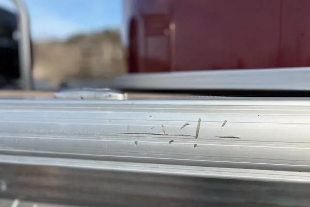 Slide: The Image of 2023 Sun Tracker Party Barge 22 DLX with minor scratches on aluminum surface. - 13