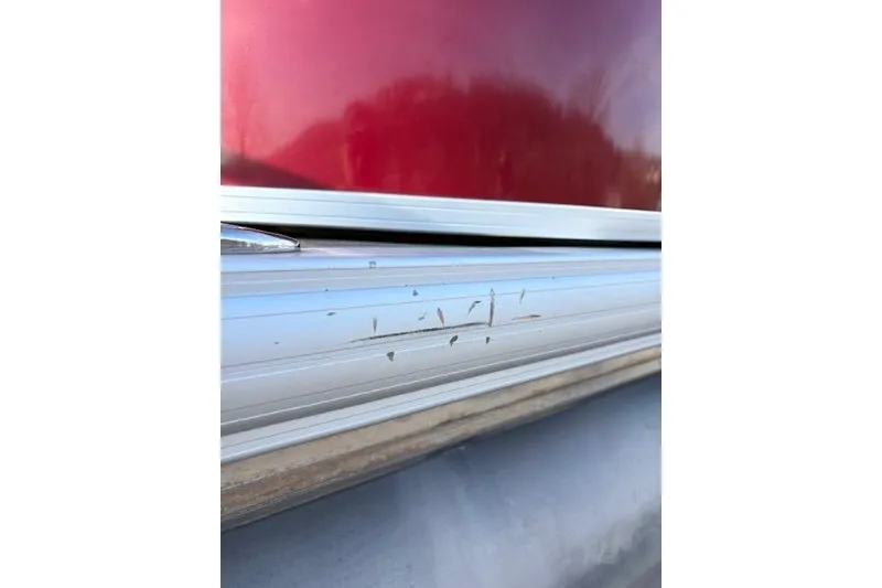 Slide: The Image of 2023 Sun Tracker Party Barge 22 DLX with minor scratches on aluminum siding. - 14