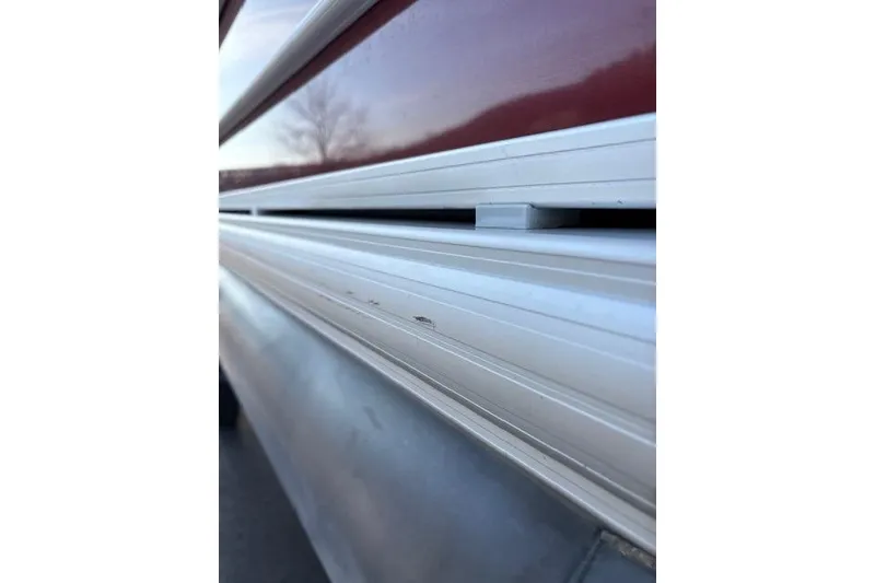 Slide: The Image of 2023 Sun Tracker Party Barge 22 DLX close-up of aluminum siding detail. - 15