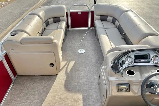 Slide: The Image of 2023 Sun Tracker Party Barge 22 DLX interior with spacious seating and modern dashboard. - 17