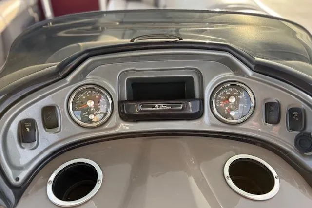 Slide: The Image of Dashboard of 2023 Sun Tracker Party Barge 22 DLX with gauges and cup holders. - 21