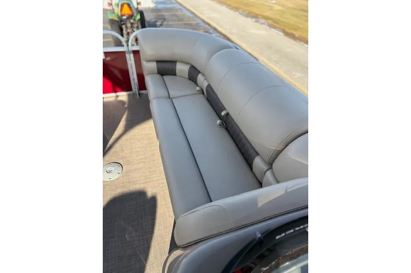Slide: The Image of 2023 Sun Tracker Party Barge 22 DLX with comfortable gray seating on deck. - 29