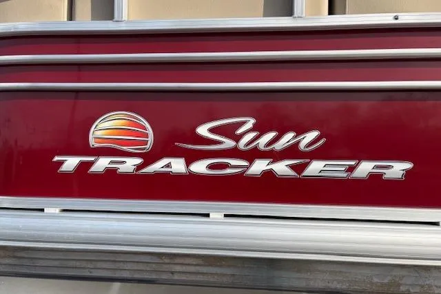 Slide: The Image of 2023 Sun Tracker Party Barge 22 DLX logo on red background. - 45