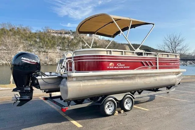 Slide: The Image of 2023 Sun Tracker Party Barge 22 DLX pontoon boat with Mercury engine on trailer. - 7