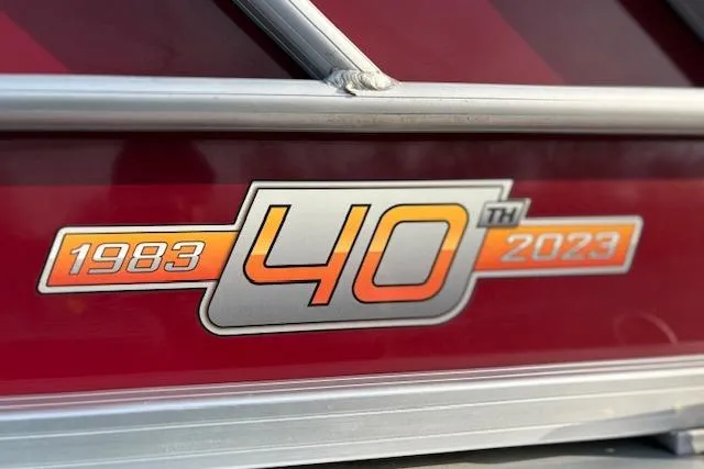 Slide: The Image of Sun Tracker Party Barge 22 DLX 40th Anniversary Edition, 1983-2023, logo detail. - 9