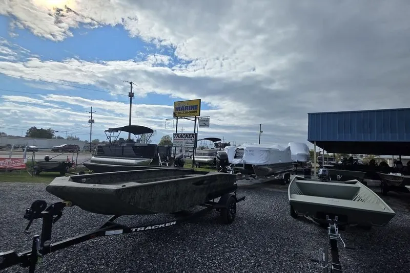 Slide: The Image of Outdoor display of 2025 Weldcraft 1652-RL boats at a dealership under cloudy skies. - 10