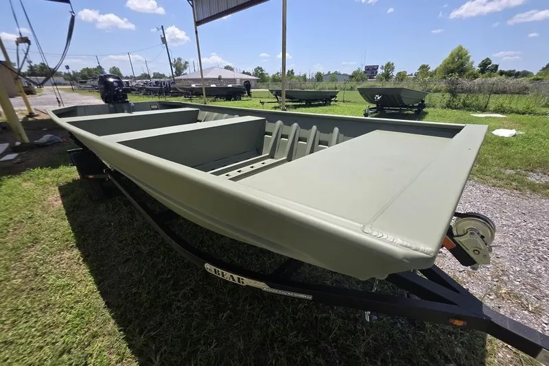 Slide: The Image of 2025 Weldcraft 1652-RL boat on trailer, parked outdoors under sunny sky. - 5
