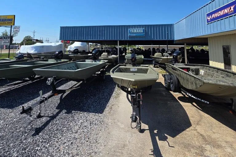 Slide: The Image of Outdoor display of 2025 Weldcraft 1652-RL boats at a dealership under a clear blue sky. - 8