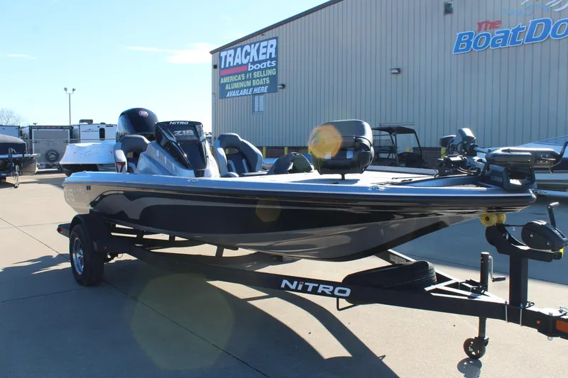 Slide: The Image of 2026 Nitro Z18 Pro boat on trailer outside dealership, featuring sleek design and modern equipment. - 1