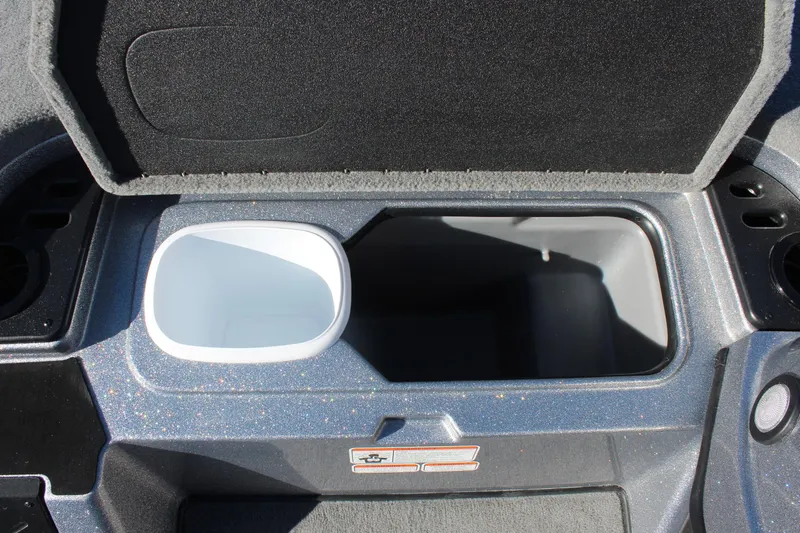Slide: The Image of Open storage compartment in 2026 Nitro Z18 Pro boat, featuring cup holders and sleek design. - 10