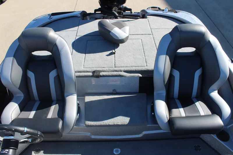 Slide: The Image of 2026 Nitro Z18 Pro boat interior with dual gray seats and carpeted deck. - 14