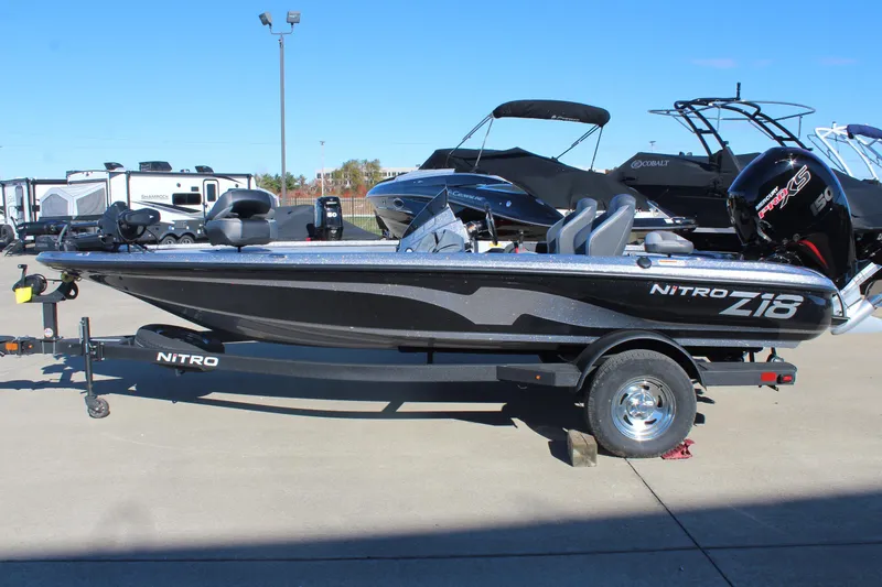 Slide: The Image of 2026 Nitro Z18 Pro boat on trailer, parked outdoors under clear blue sky. - 4