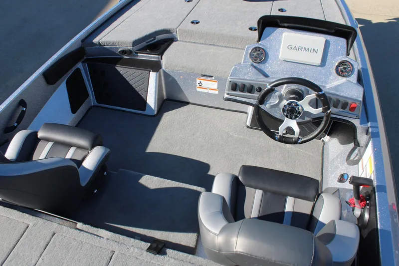 Slide: The Image of 2026 Nitro Z18 Pro boat interior with Garmin dashboard and dual seating. - 6