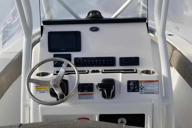 Slide: The Image of 2022 Sea Fox 248 Commander boat dashboard with steering wheel and control panel. - 14