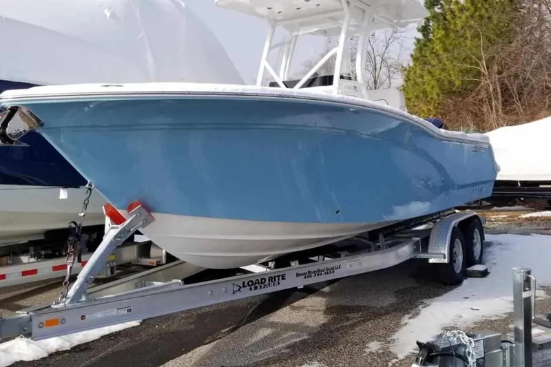 Slide: The Image of 2022 Sea Fox 248 Commander boat on trailer, parked in snowy area. - 3