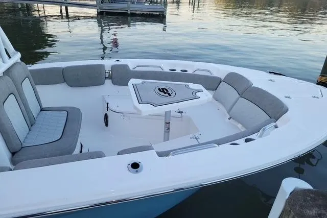 Slide: The Image of 2022 Sea Fox 248 Commander boat with spacious seating and sleek design on calm water. - 7