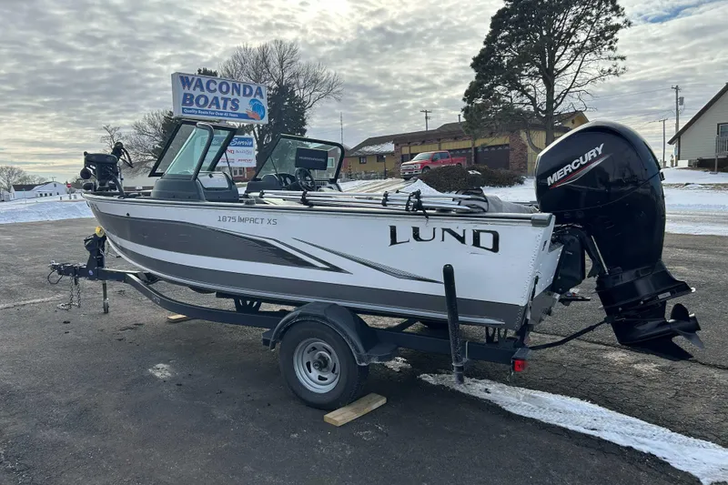 Slide: The Image of 2020 Lund 1875 Impact boat with Mercury engine on trailer at Waconda Boats dealership. - 2