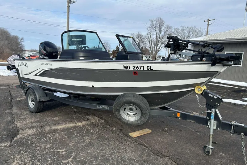Slide: The Image of 2020 Lund 1875 Impact boat on trailer, parked outdoors in winter setting. - 5