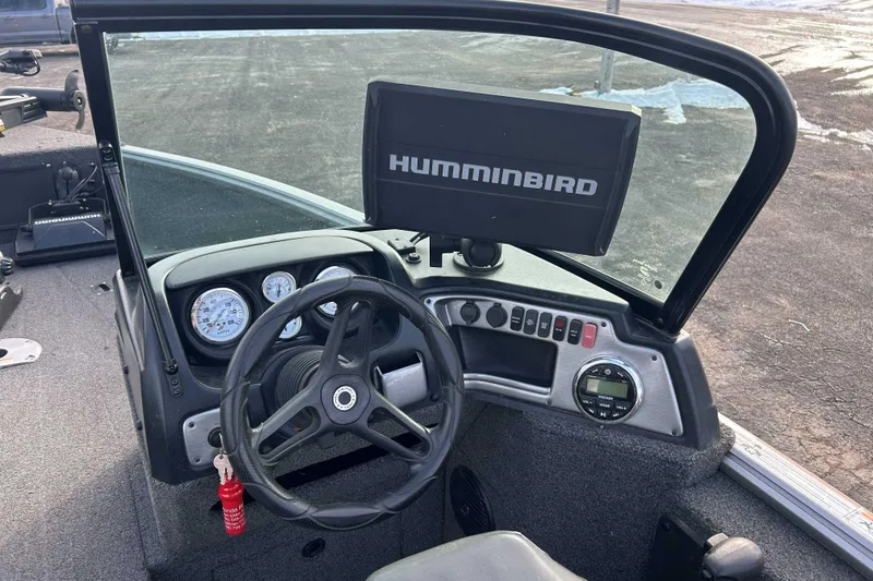 Slide: The Image of 2020 Lund 1875 Impact boat dashboard with Humminbird fish finder and steering wheel. - 7