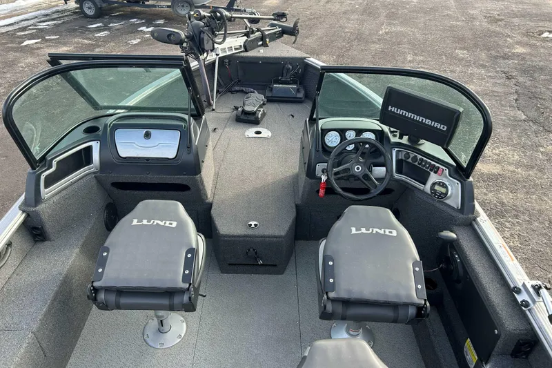 Slide: The Image of 2020 Lund 1875 Impact boat interior with steering wheel and Humminbird display. - 8