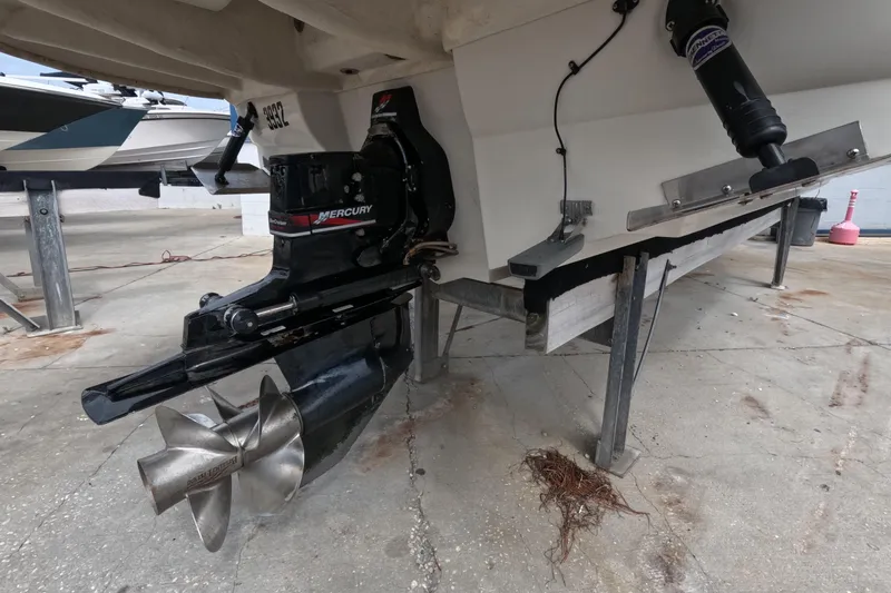 Slide: The Image of 2001 Sea Ray 240 Sundeck boat with Mercury outboard motor on a trailer. - 14