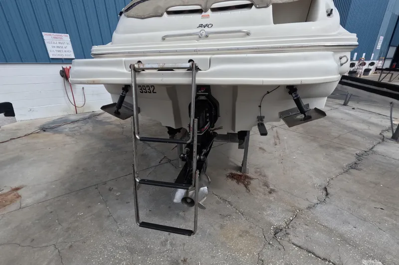 Slide: The Image of Rear view of a 2001 Sea Ray 240 Sundeck boat with ladder and propeller. - 20