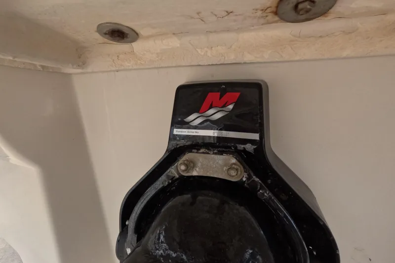 Slide: The Image of Close-up of a 2001 Sea Ray 240 Sundeck boat component with logo and serial number. - 24