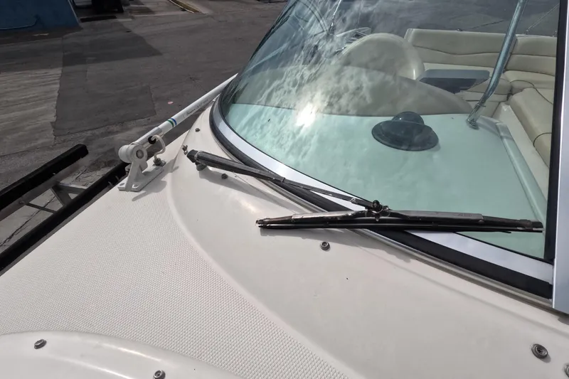 Slide: The Image of 2001 Sea Ray 240 Sundeck boat windshield and wiper detail. - 47