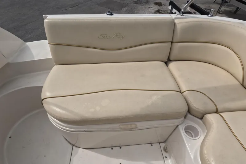 Slide: The Image of Cream-colored seating on a 2001 Sea Ray 240 Sundeck boat. - 58