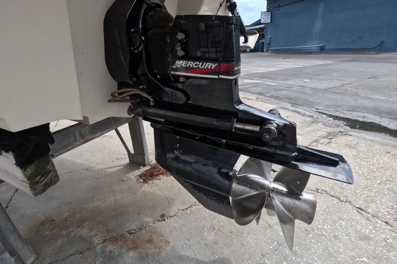 Slide: The Image of Close-up of a 2001 Sea Ray 240 Sundeck's Mercury outboard motor and propeller. - 6