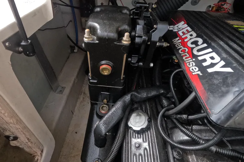 Slide: The Image of Engine compartment of a 2001 Sea Ray 240 Sundeck with Mercury MerCruiser components. - 61