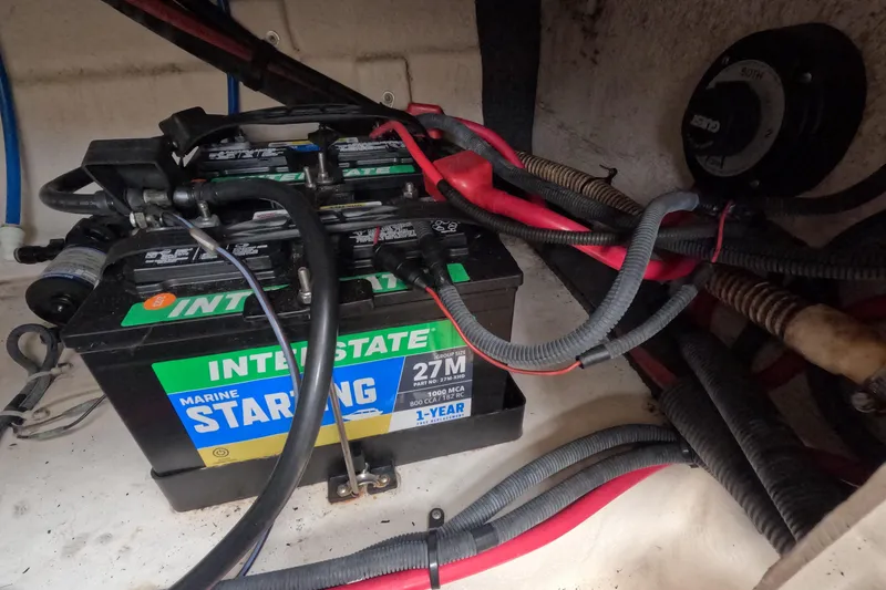 Slide: The Image of Battery compartment of a 2001 Sea Ray 240 Sundeck with Interstate marine battery. - 65