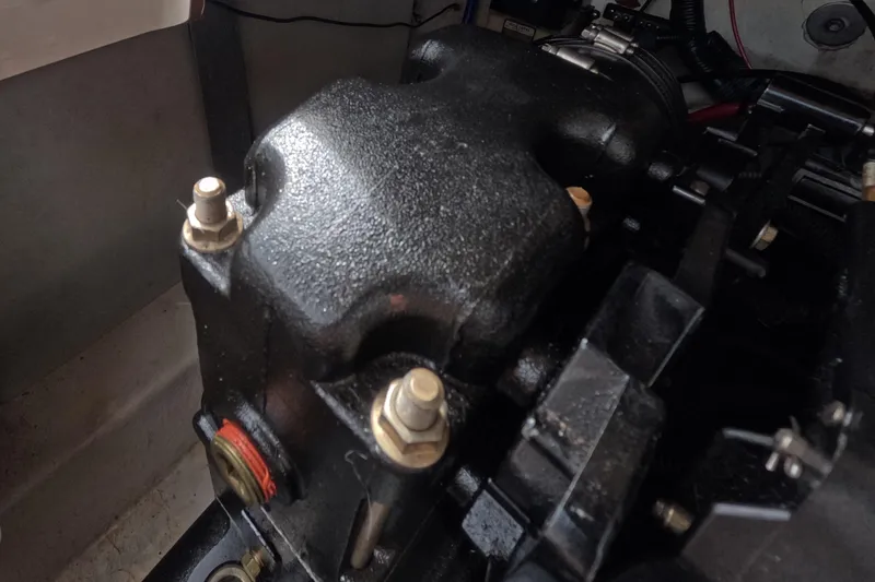 Slide: The Image of Engine component of a 2001 Sea Ray 240 Sundeck boat, close-up view. - 66