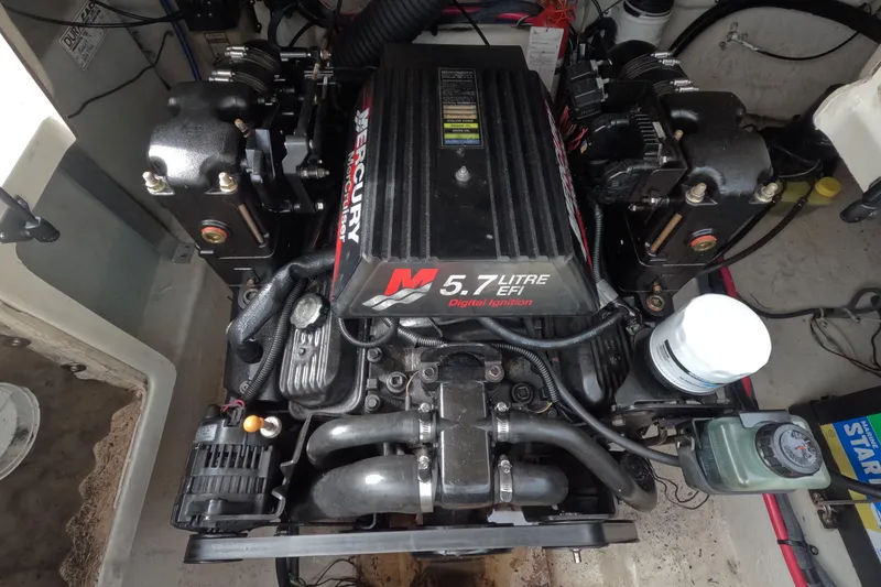 Slide: The Image of Engine compartment of a 2001 Sea Ray 240 Sundeck with 5.7L EFI Mercury engine. - 67