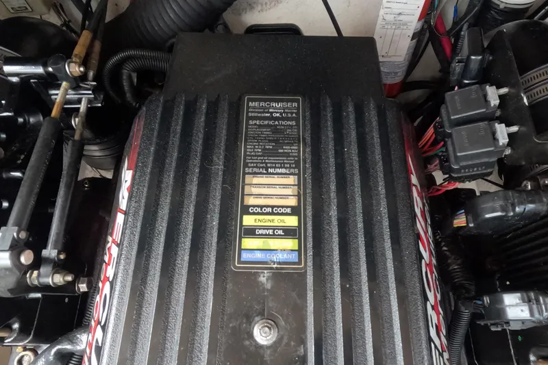 Slide: The Image of Engine compartment of a 2001 Sea Ray 240 Sundeck with MerCruiser components. - 69