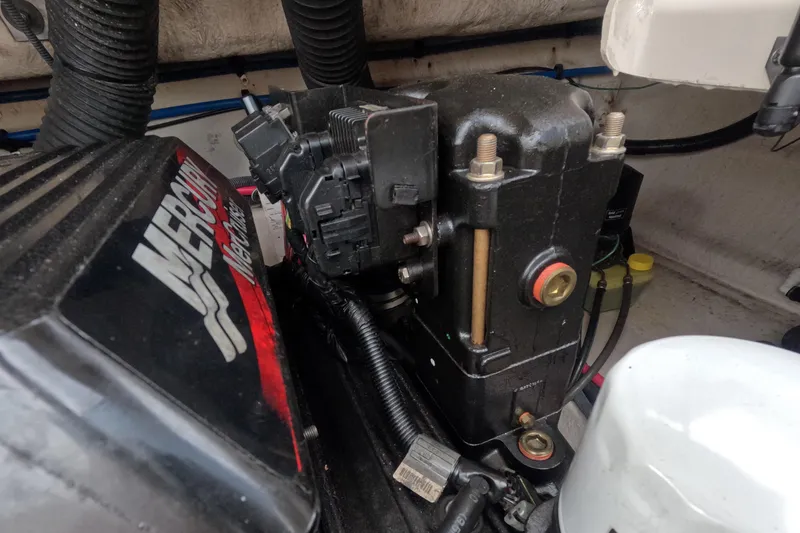 Slide: The Image of Engine compartment of a 2001 Sea Ray 240 Sundeck with MerCruiser components. - 71