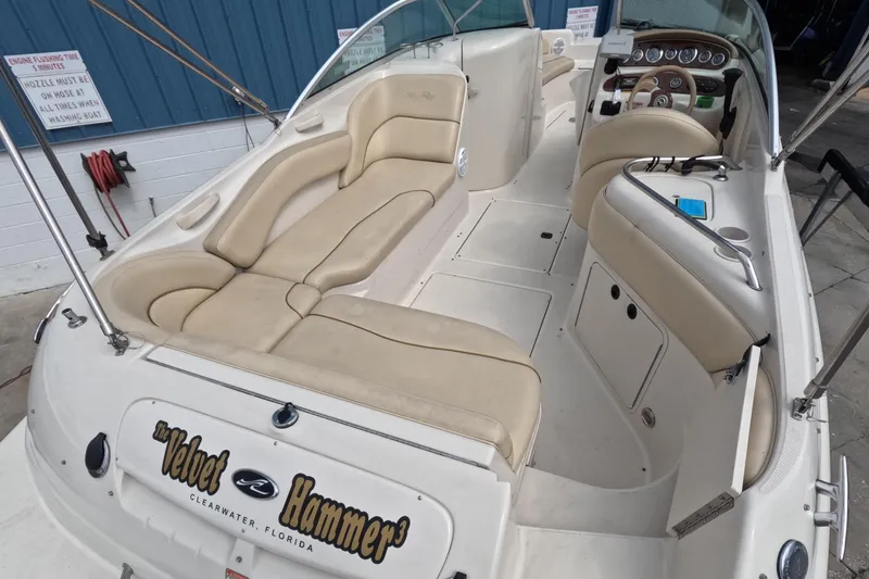 Slide: The Image of 2001 Sea Ray 240 Sundeck boat interior with beige seating and dashboard, Clearwater, Florida. - 8