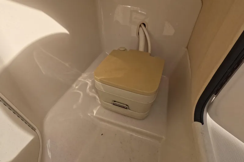 Slide: The Image of Portable toilet in 2001 Sea Ray 240 Sundeck boat interior. - 9