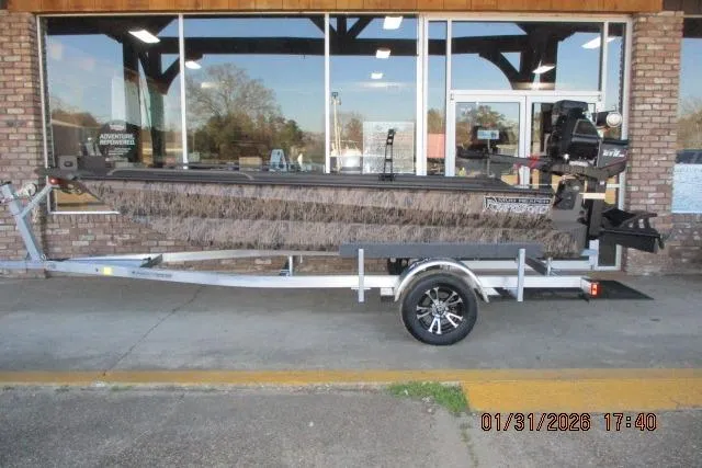 The Image of 2026 Reaper Boats 656-1830 MUD on trailer, parked outside a building. - 0