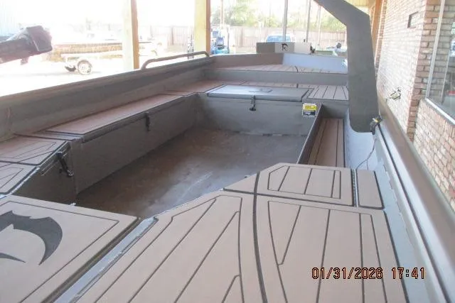 Slide: The Image of 2026 Reaper Boats 656-1830 MUD interior with spacious deck and seating. - 3