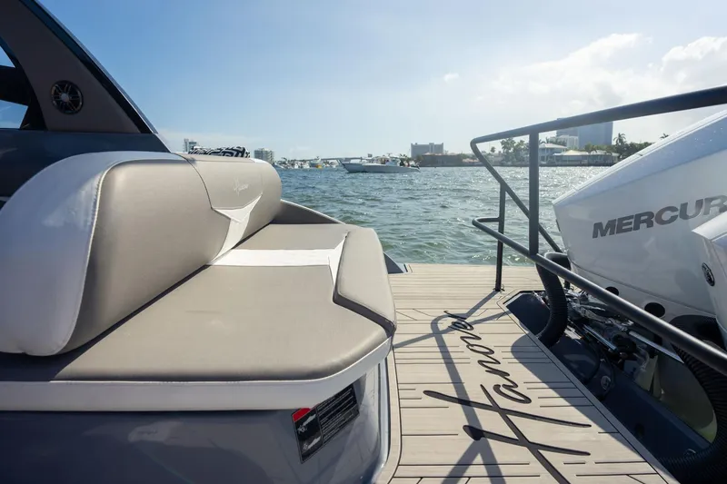 Slide: The Image of Luxury Hanover 305 boat, 2026 model, with sleek seating and powerful Mercury engine on open water. - 30